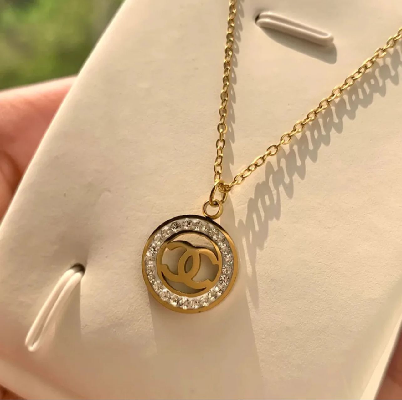 REGAL™ STONE EMBEDDED CHANEL PENDANT.