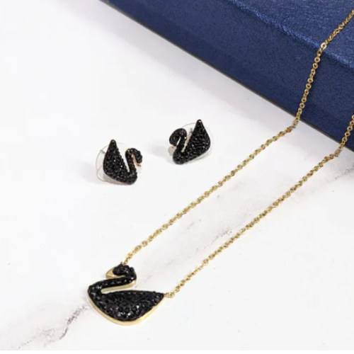 REGAL™ GOLD TONED BLACK SWAN PENDANT SET.