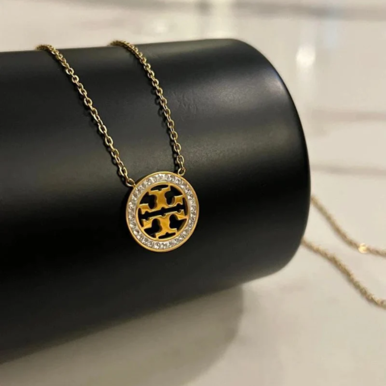 REGAL™ TORY BURCH PENDANT.